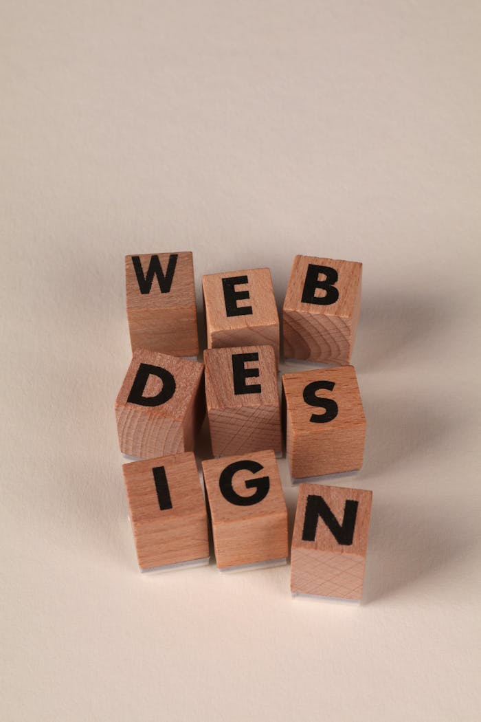 services-03 Wooden blocks arranged to spell Web Design. Perfect for creative, digital content themes.